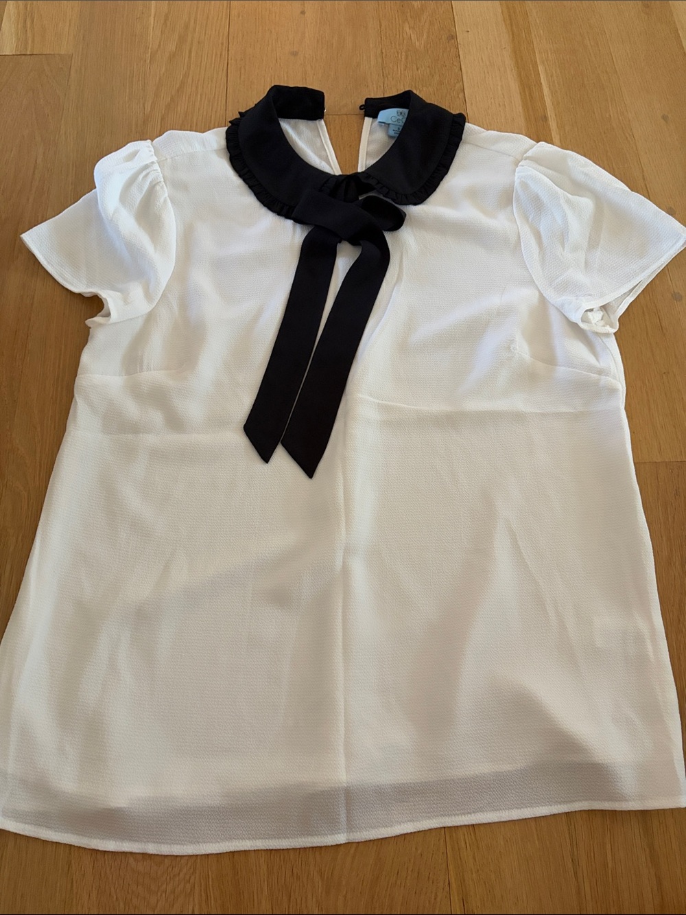 CeCe White Short Sleeve Blouse with Black Ruffle Tie Collar